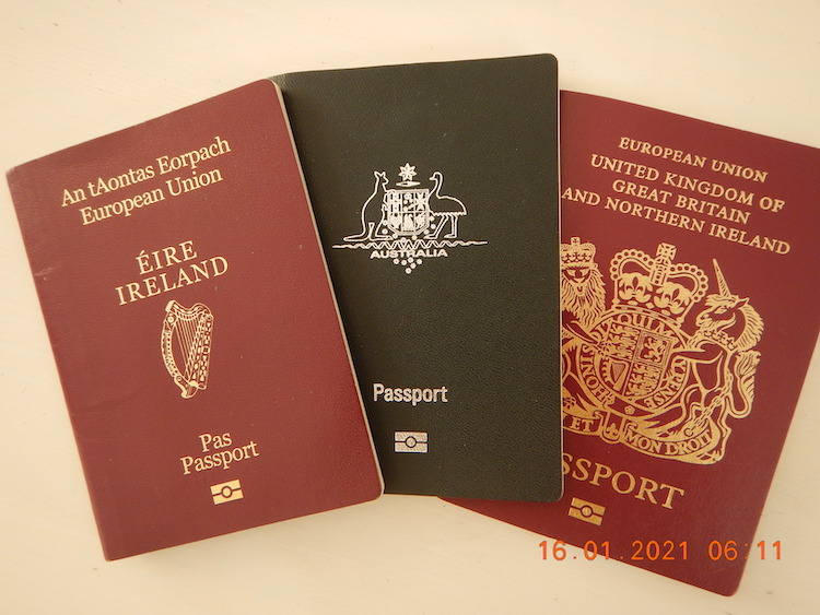 Three passports, from the U.K., Republic of Ireland, and Australia