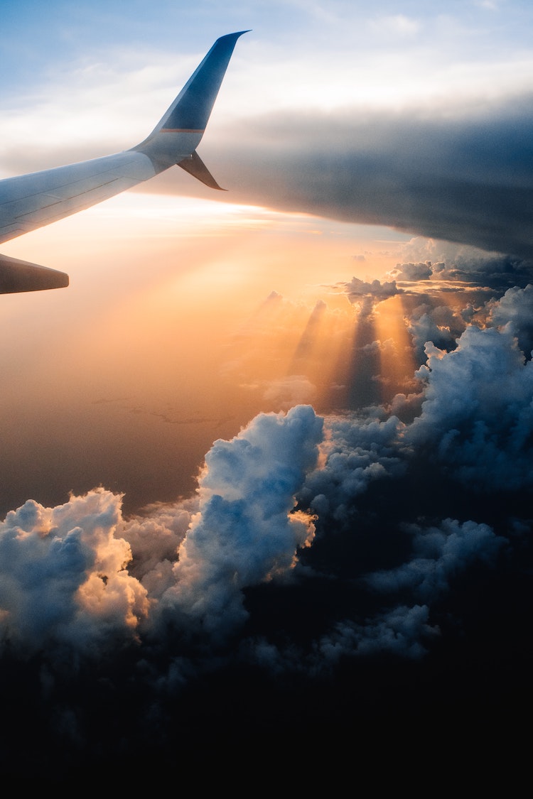 View of a plane wing at sunset